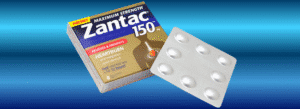 A box of Zantac 150 mg tablets is shown next to a blister pack containing six tablets, on a blue gradient background.