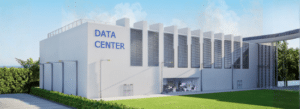 A large white building labeled "Data Center" with vertical vents on the wall, surrounded by greenery and a clear sky.